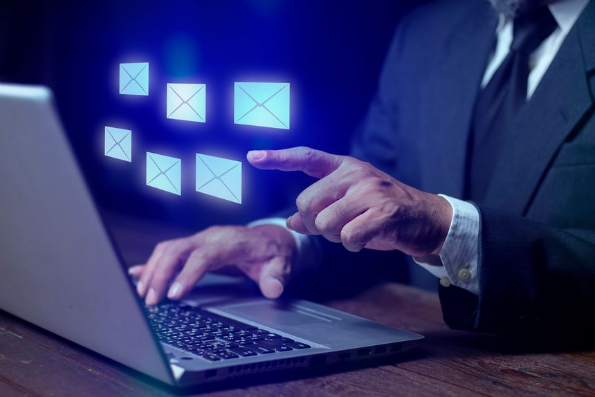 Businessman using laptop with email icon, Inbox with email marketing strategy and notifications. Online messaging, Digital marketing, Newsletter, email automation, and Corporate contact.