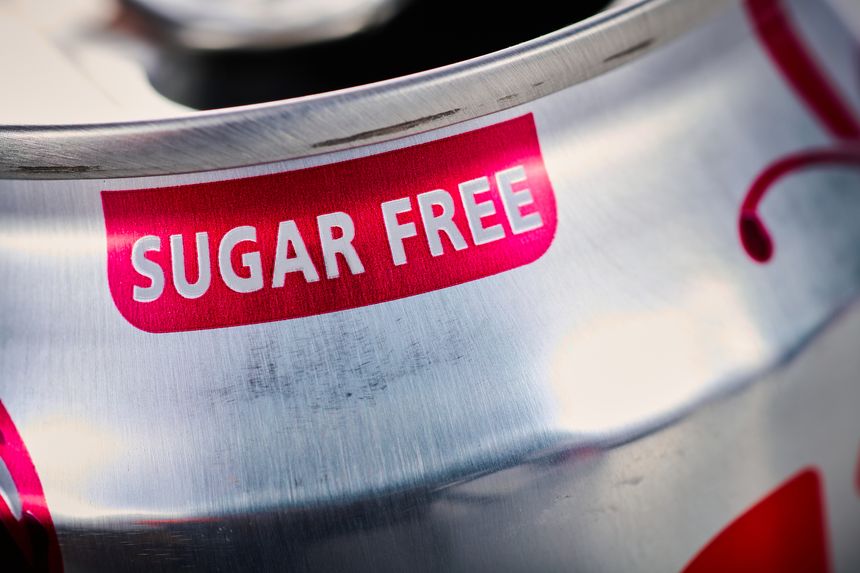 Close-up of a label indicating sugar free on an aluminum can of soda.
