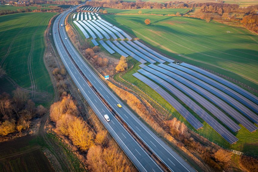 next to a freeway A20 in Germany is a photovoltaic open space plant