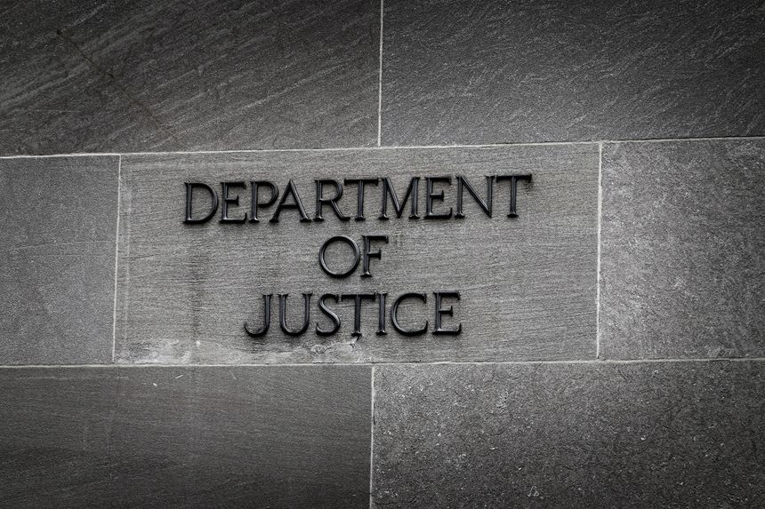 Detail of Sign on Building for the US Department of Justice in United States Upholding Laws of the Land Federal Agency