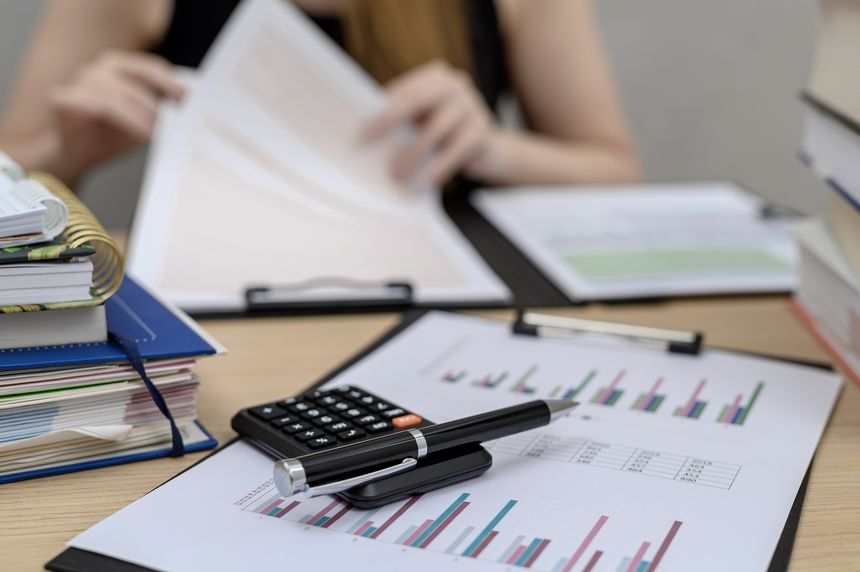 An accountant sitting at her desk at work, doing annual tax returns, training in KSEF