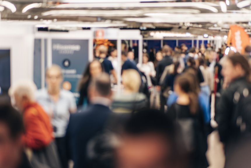 Abstract blurred people at exhibition hall of expo event trade show. Business convention show or job fair. Business concept background