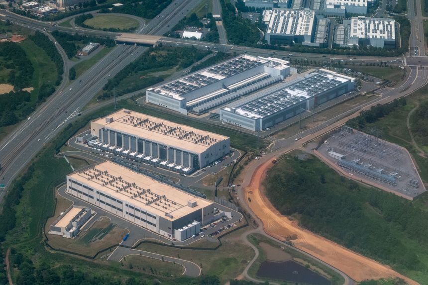 Ashburn, Virginia, USA - July 30, 2026 - Aerial view of a dense cluster of data centers, including facilities under construction, in Loudoun County's Data Center Alley in Northern Virginia