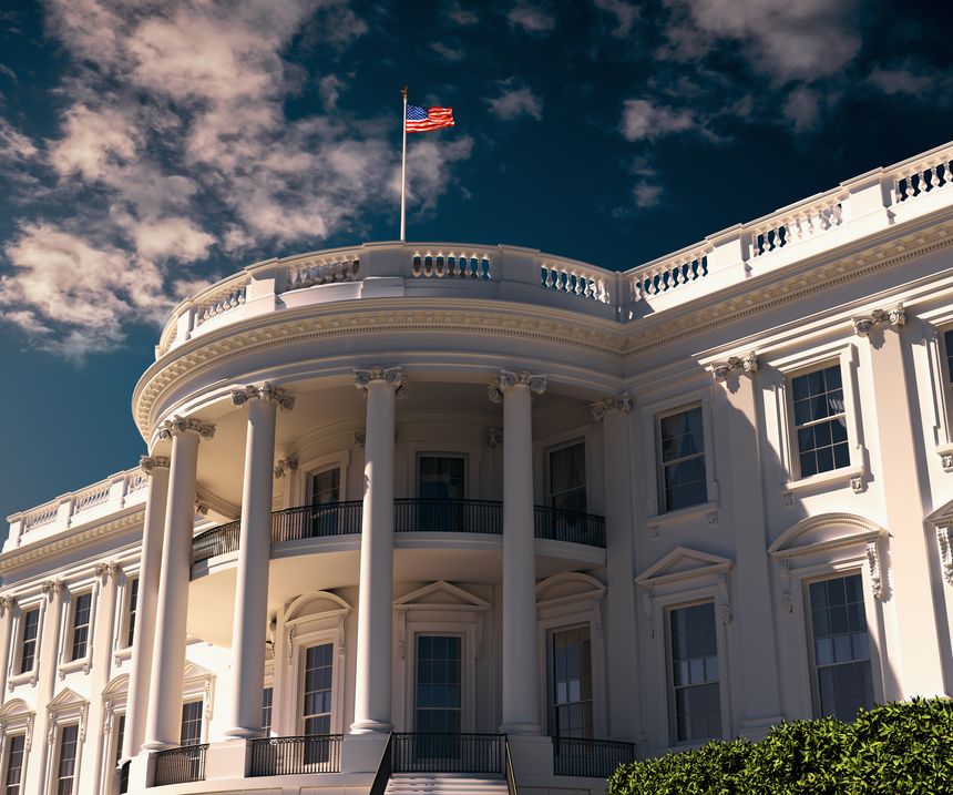 3D illustration of the White House in Washington, D.C., with its iconic neoclassical facade, columns and American flag under dramatic clouds, representing US government and politics.