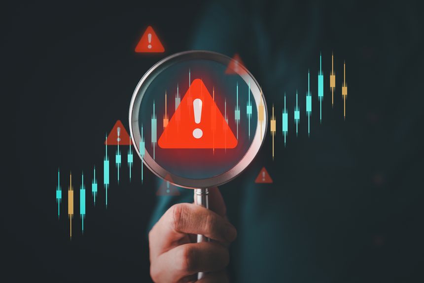 AI risk monitoring concept with magnifying glass analyzing stock market candlestick chart and warning alert symbol for financial volatility and smart investment surveillance