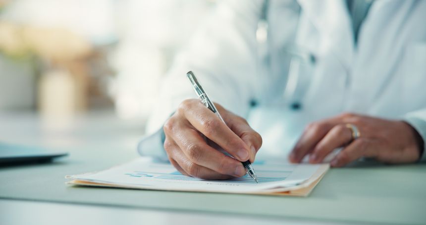 Hands, doctor and writing prescription at hospital in office, documents and recommendation with advice. Person, medical professional and paperwork for medicine, report and administration at clinic