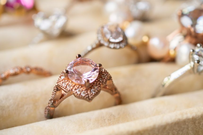 Collection of luxury diamond rings and pearl jewelry in velvet display box, elegant jewelry background