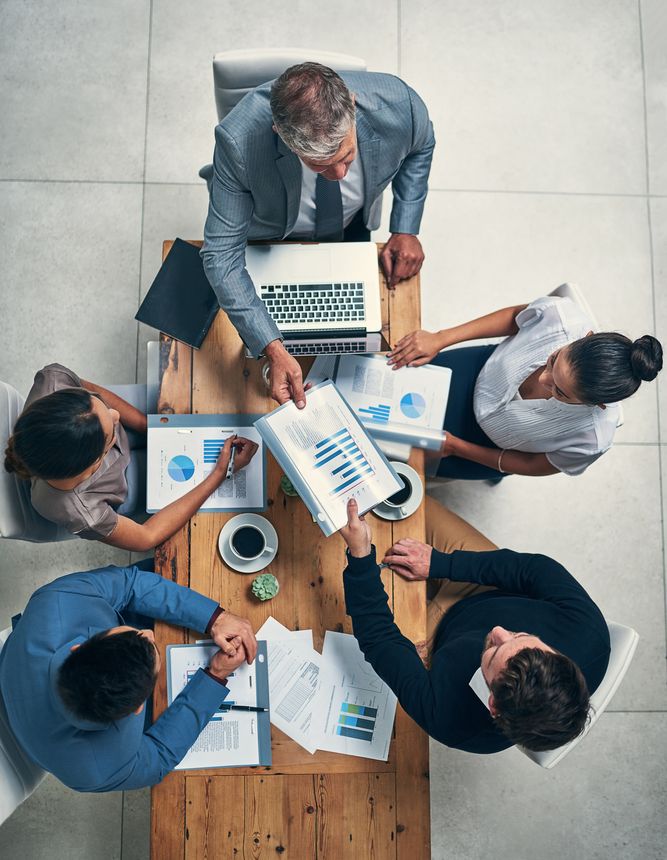 High angle shot of a group of businesspeople having a meeting in an office
