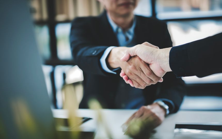 Businessman handshake for teamwork of business merger and acquisition, businessman shake hand with partner
