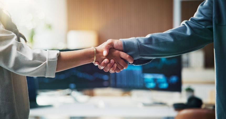 Handshake, contract and business people in office with coding project, agreement or partnership. Meeting, welcome and programmer shaking hands with client for web development deal in workplace.